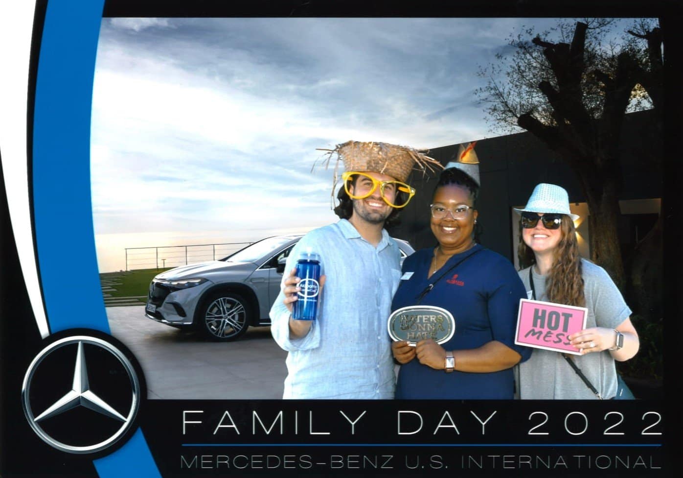 3 people stand in a photo with the words Family Day 2022 for the Alabama Cancer Care of Tuscaloosa